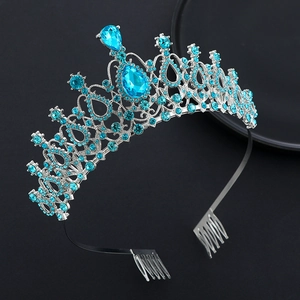 Detailed view of silver crystal tiara with light blue rhinestones and teardrop jewels