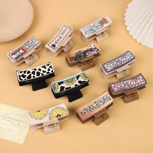Western cowboy style leather claw clips with cactus sunflower and bull patterns