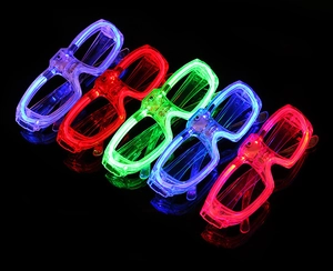 Detailed close-up of colorful LED glowing square glasses in blue, red, and green lights