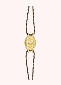 Detail of gold hexagon sunburst pendant with marquise gem and black cord chain