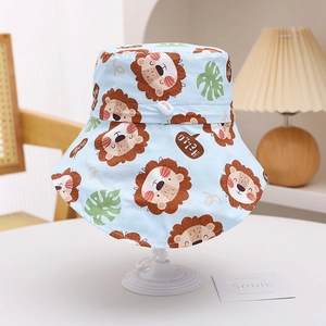 Detail of blue sun hat showing cartoon lion prints and adjustable drawstring toggle