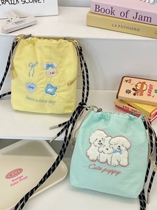 Cute canvas bucket bags with dog embroidery in light yellow and mint green colors