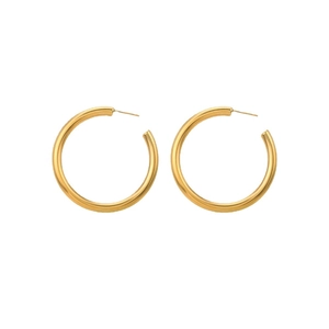 Minimalist golden hoop earrings in chunky circular design with high polished finish