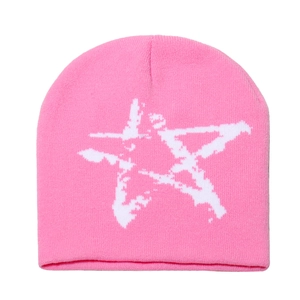 Detailed knit texture of pink Y2K beanie with white star pattern and ribbed cuff edge