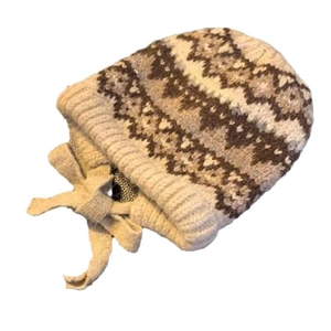 Brown geometric knit Fair Isle beanie hat with tie straps and warm woolen pattern