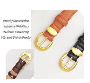 Detail of elegant crocodile-pattern leather belts with matte gold oval buckles for women