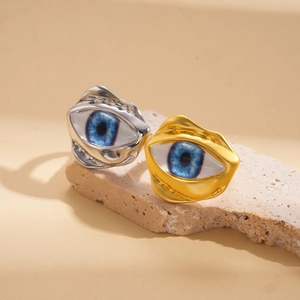 Irregular resin evil eye open ring set in gold and silver finish on stone
