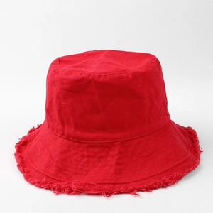 Detail shot of the frayed edges on a bright red vintage cotton canvas bucket hat