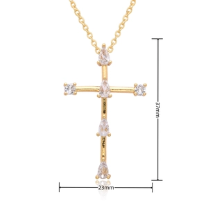 Detail view of gold cross pendant necklace with 37mm height and 23mm width dimensions