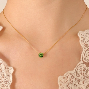 Elegant gold necklace for women featuring a round green zircon pendant in a claw setting