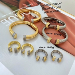 Luxurious 18K gold plated jewelry set with ribbed cuff bracelet and pavé diamond ring
