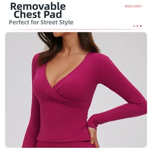 Detail of V-neck yoga top featuring removable chest pads and stretch purple fabric