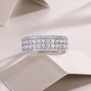 Detailed close-up of 925 sterling silver ring with multi-row pavé moissanite stones