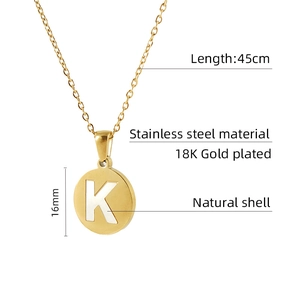 Detail of 18K gold plated stainless steel necklace with 16mm natural shell K pendant