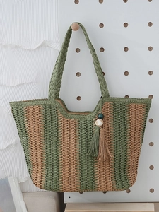 Vertical striped green and beige woven straw tote bag with beaded tassel charm