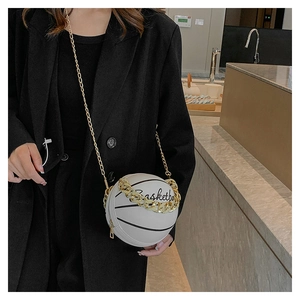 Detail of white basketball shaped crossbody bag with gold chain and black text