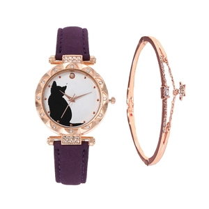 Detail of rose gold cat watch with purple matte strap and matching star charm bracelet