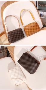 Close-up of vintage geometric pattern on a stylish cylinder bag with golden hardware