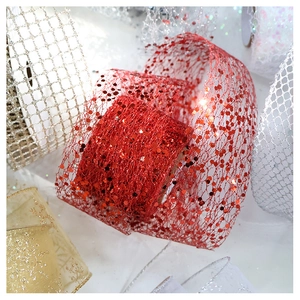 Macro shot of glittery chiffon ribbon rolls for festive Christmas tree decoration