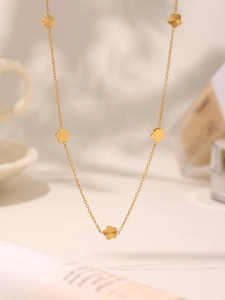 Detailed view of the 18K gold plated flower pendant necklace with elegant floral charms
