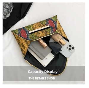 Internal capacity of snake pattern envelope clutch holding a phone, sunglasses and cosmetics