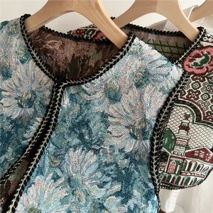 Ethnic style embroidered vest shawl with floral patterns and woven piping detail