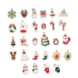 Flat lay of 24 Christmas alloy pendants including snowflakes, reindeer, and Santa Claus