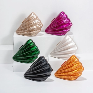 Detailed display of shell-shaped acrylic clutches in six vibrant colors for evening
