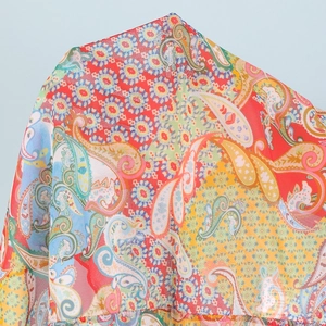 Detail of vibrant paisley and mandala patterns on bohemian style woven fabric