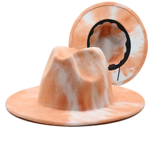 Orange and white tie-dye wide brim fedora hat with a stylish jazz style design