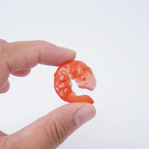 Lifelike PVC mini shrimp tail model food prop with detailed texture on white background