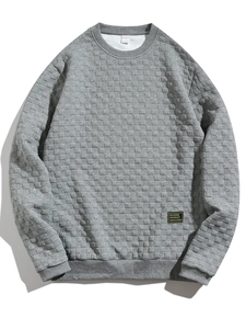 Detail shot of men's grey long sleeve shirt with a waffle textured fabric and crew neck