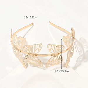 Close-up of golden metal butterfly headband featuring detailed hollow design and dimensions
