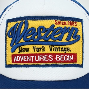 Retro Western embroidered baseball cap in blue and white with vintage patch design