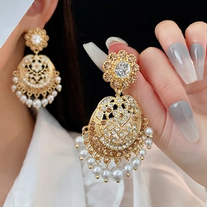 Vintage gold mandala hollow earrings with shimmering crystals and dangling white pearls