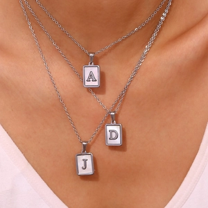 Three-layer silver titanium necklace with white shell letter pendants A, D and J