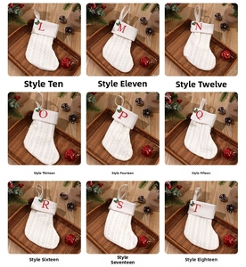 Detailed grid of cream knit Christmas stockings with embroidered letters and festive decor