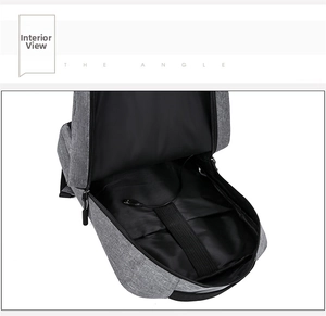 Detail view of the gray backpack interior with built-in USB cable and storage pocket