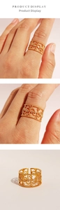 Detail of vintage gold wide hollow ring with lace carving and zircon accents
