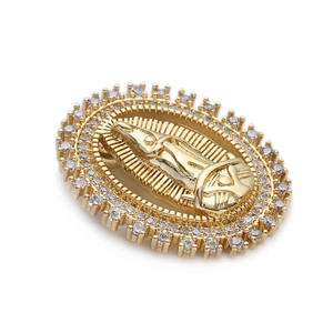 Macro detail of oval 14K gold-plated Virgin Mary pendant with clear zircon inlay