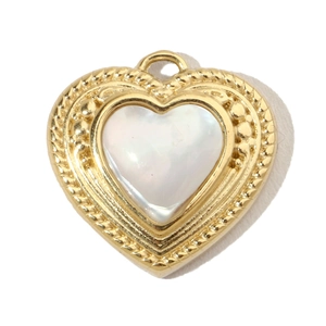 Detailed shot of a heart-shaped gold-plated stainless steel pendant with white shell inlay