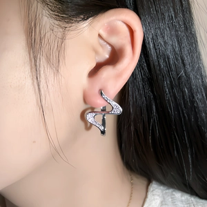 Silver wavy abstract ear crawler with frosted texture finish and 24k gold plating