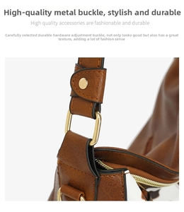 Detail shot of caramel brown and white pebble leather with gold-tone hardware and stitching