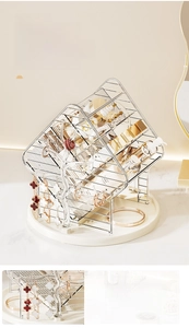 Rotating makeup organizer with silver metal frame and jewelry tree branch hanger