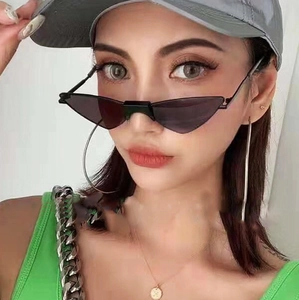 Trendy triangle cat-eye sunglasses with black metal frame worn by a female model