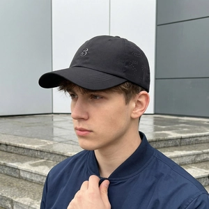 Men's breathable black baseball cap with silver S logo and laser-cut ventilation holes