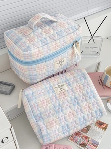 Two-piece quilted checkered cosmetic bag set with heart stitching in blue and pink