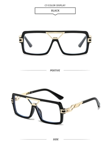 Detail view of black square sunglasses with gold hollow metal temples and side profile