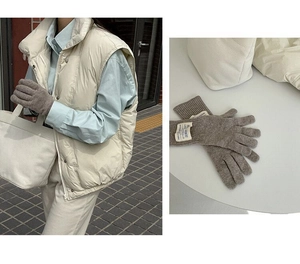 Detail of grey knitted wool gloves showing outdoor lifestyle use and flat layout view