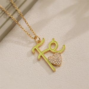 Gold Fe letter heart necklace with light green enamel and pavé micro-inlay finish